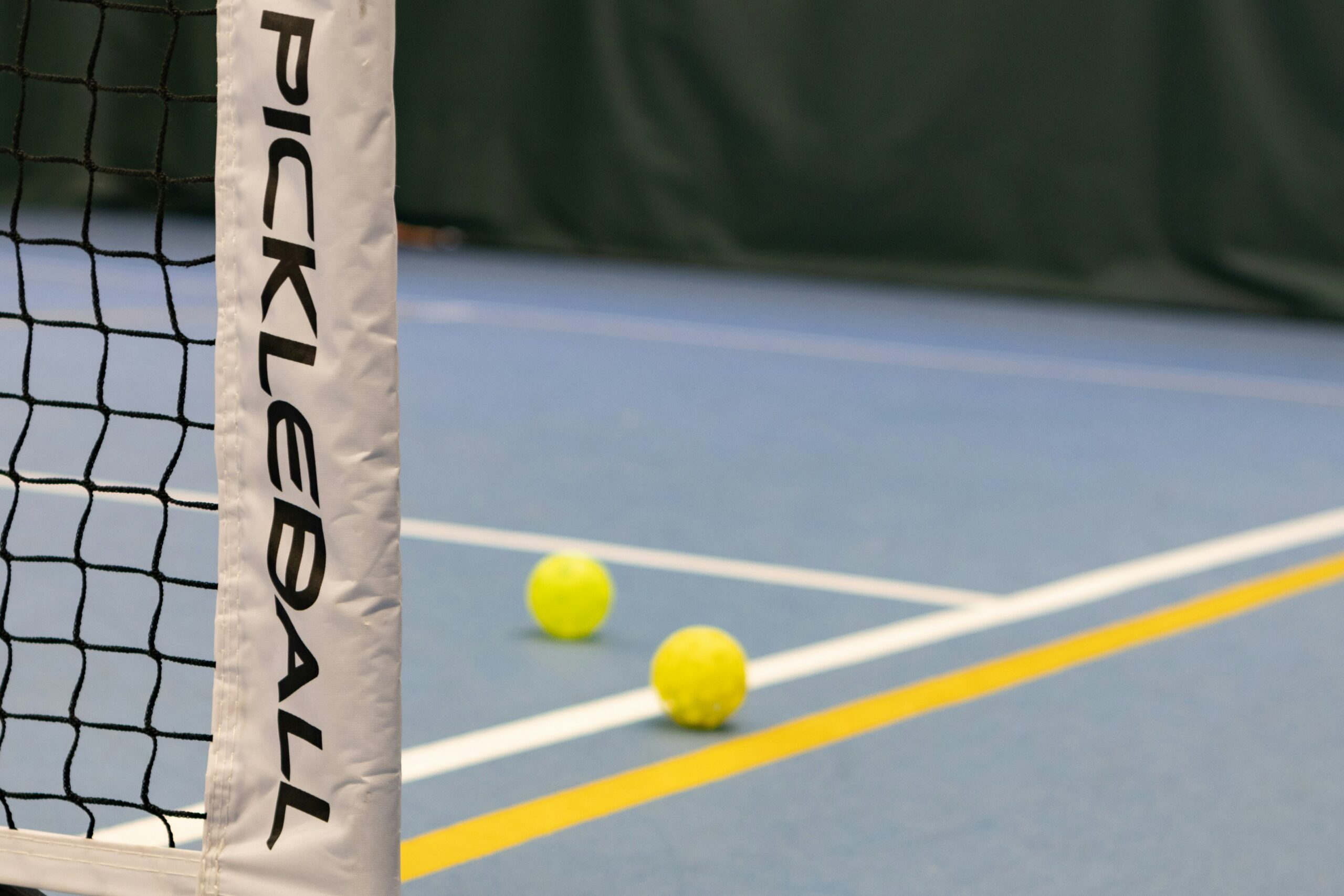 A pickleball net, showcasing its height vs a tennis net.